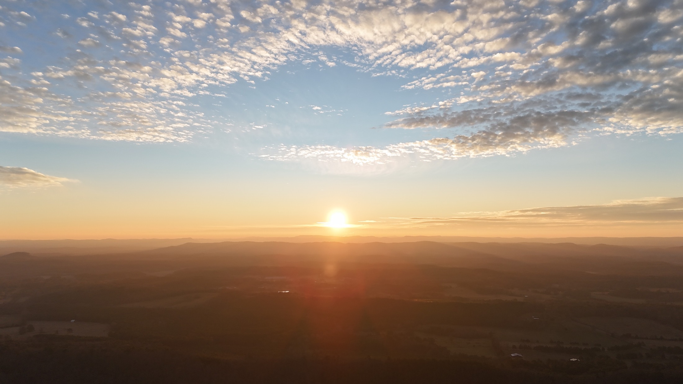 Sunrise and clouds above the Lookout Mountain horizon near Cairnwood